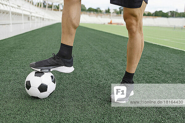 Man with soccer ball on field