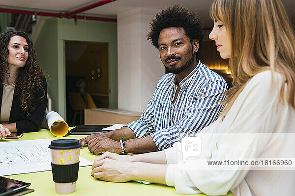 Businessman having a meeting with colleagues in office