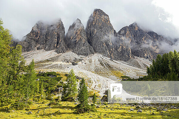 Scenic view of majestic foggy mountains  Dolomites  Italy