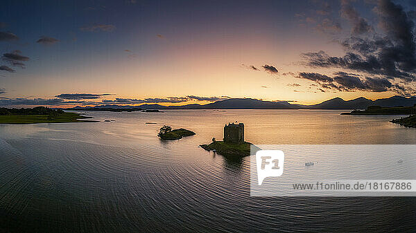 Aerial view of Castle Stalker on Loch Linnhe island at sunset  Scotland
