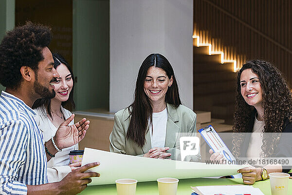 Smiling business team having a meeting in office