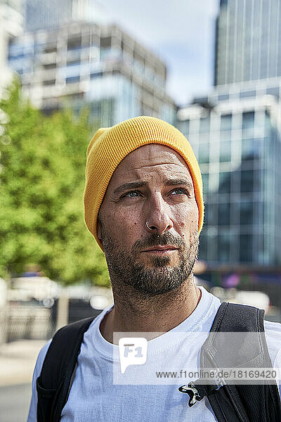 Man with beard wearing yellow knit hat