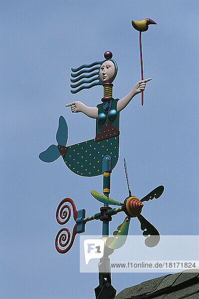 A colorful mermaid shaped weather vane.; Brewster  Cape Cod  Massachusetts.