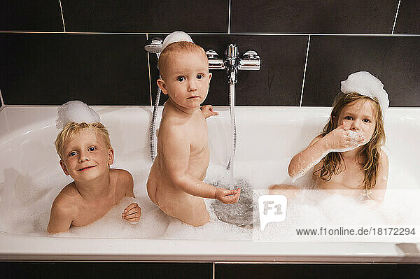 Three Children having Bath in Bathtub