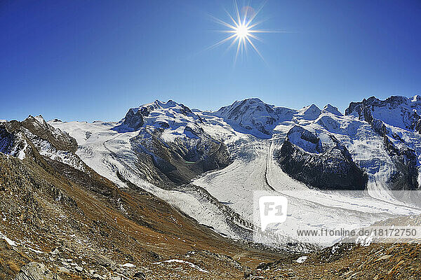 View from Gonergrat with Sun over Gorner Glacier  Monte Rosa Glacier and Monte Rosa Mountain Range  Zermatt  Alps  Valais  Switzerland