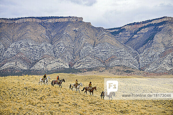 Cowboys and Cowgirls riding horse in wilderness  Rocky Mountain  Wyoming  USA