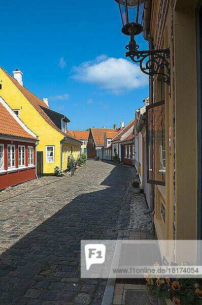 Typical painted houses and Cobblestone Street  Aeroskobing Village  Aero Island  Jutland Peninsula  Region Syddanmark  Denmark  Europe