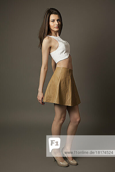 Full Length Portrait of Young Woman Modelling Clothes  Studio Shot