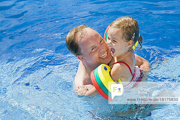 Father and Daughter in Swimming Pool