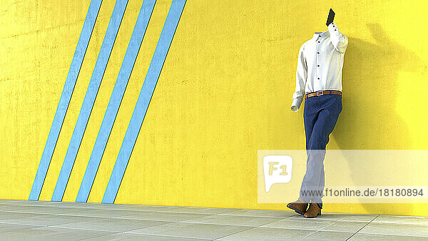 Invisible person talking on phone in front of yellow wall