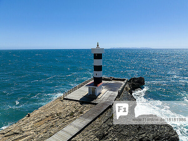 Spain  Balearic Islands  Colonia de Sant Jordi  Aerial view of lighthouse on Mediterranean coast in summer