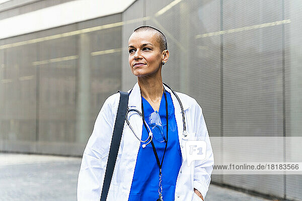 Thoughtful mature healthcare worker with stethoscope