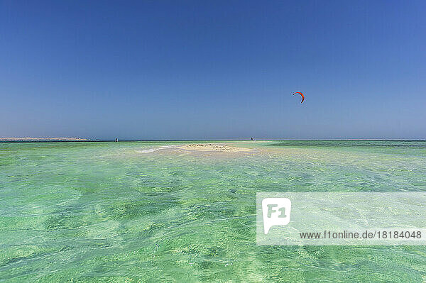 Egypt  Red Sea Governorate  Hurghada  Turquoise waters of Red Sea with paraglider flying in background
