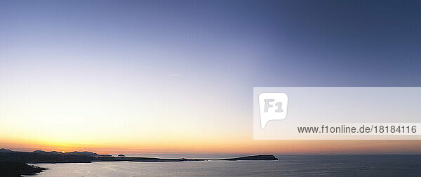 Spain  Balearic Islands  Menorca  Panoramic view of sky over Cap of Cavalleria at sunset
