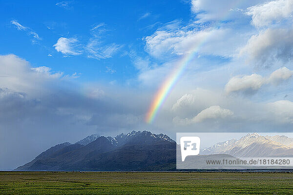 New Zealand  Canterbury Region  Scenic view of rainbow arching over Tasman Valley
