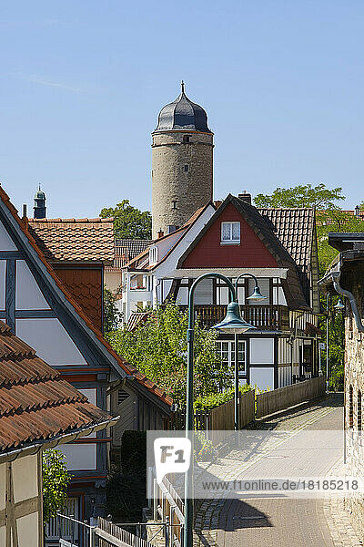 Germany  North Rhine-Westphalia  Warburg  Old town alley with city gate tower in background