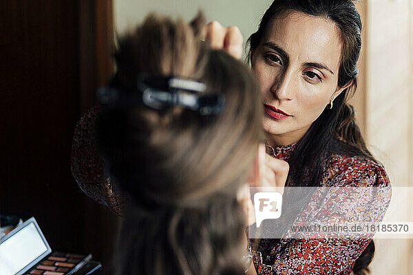 Make-up artist applying make-up to customer