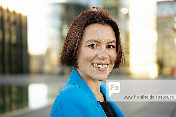 Happy businesswoman with short brown hair
