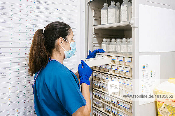 Nurse arranging and taking inventory at hospital