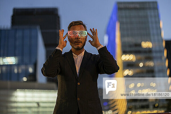 Businessman wearing smart glasses in city