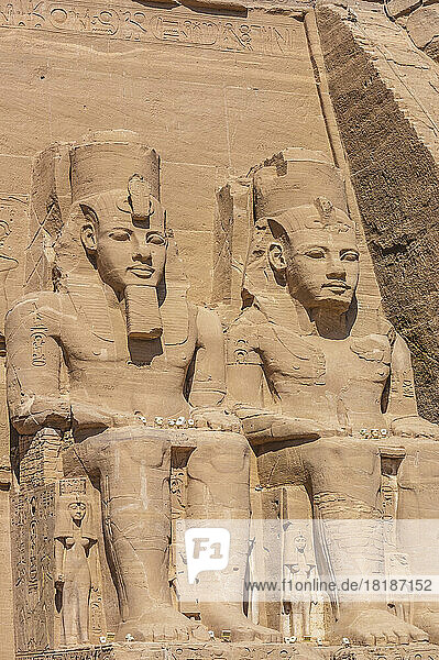 Egypt  Aswan Governorate  Giant statues at entrance of Great Temple of Rameses II