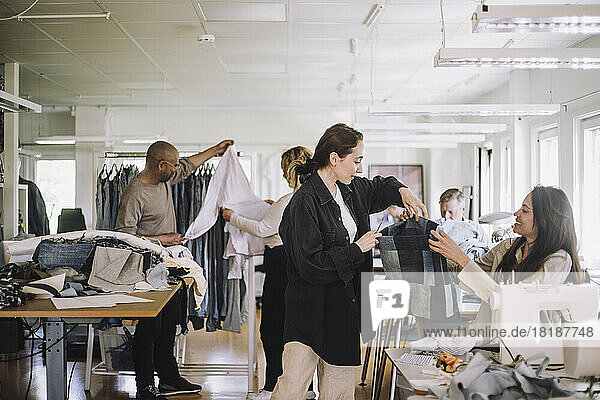 Fashion designers working together at workshop