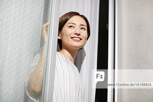 Japanese woman looking out the window
