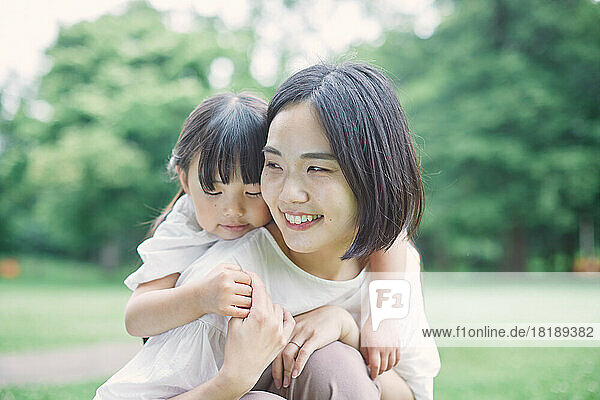 Japanese kid with her mother at city park