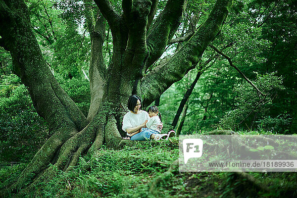 Japanese kid with her mother at city park