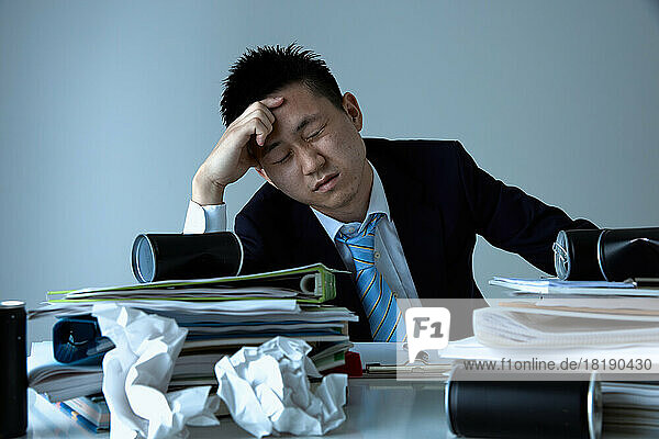 Tired Japanese businessman