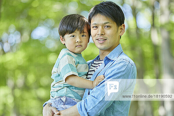 Japanese father holding his child