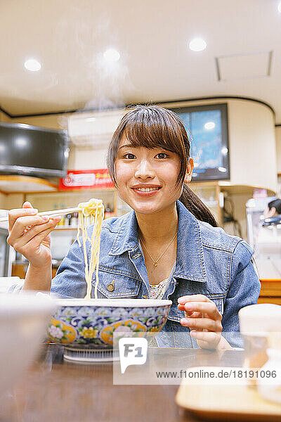 Japanese woman eating tantan noodles