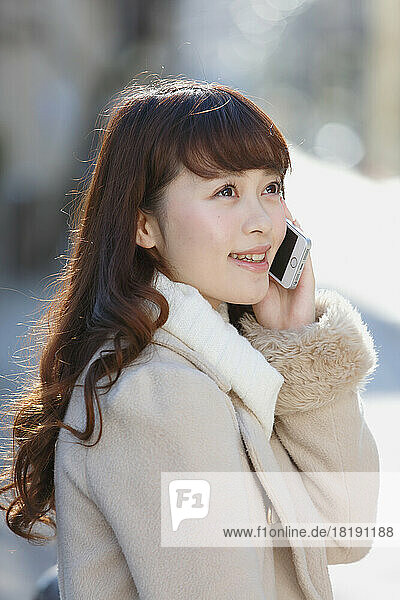 Japanese woman talking on a mobile phone