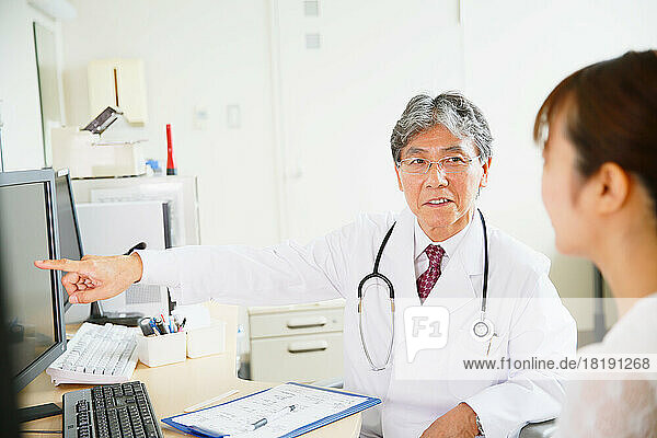Patient being examined by a Japanese doctor in a doctor's office