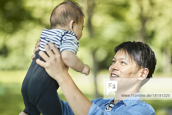 Japanese father holding baby