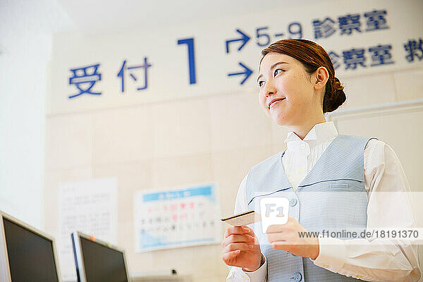 Young Japanese woman at the hospital reception