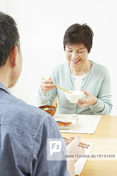 Japanese senior couple eating their meal