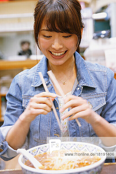 Japanese woman eating tantan noodles