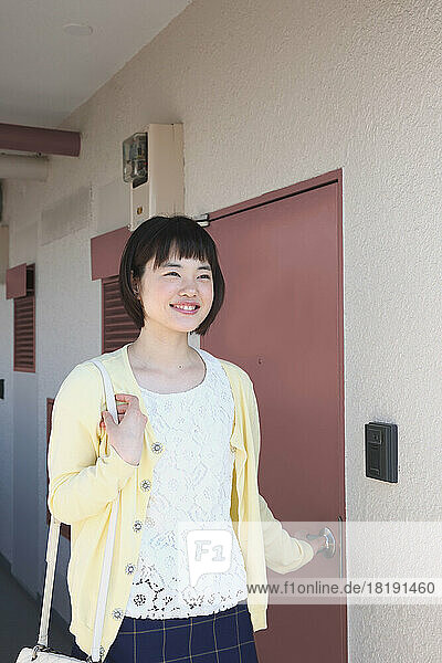 Young Japanese woman heading out