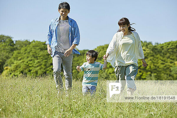 Japanese parents watching over running child