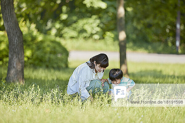 Japanese parent and child playing in the park