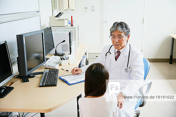 Girl being examined by a Japanese doctor