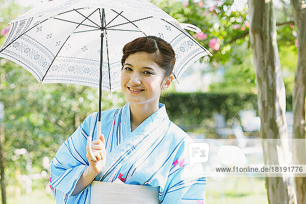 Japanese woman in a yukata with a parasol