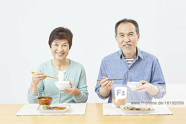 Japanese senior couple eating