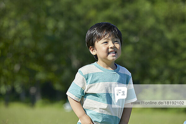 Fresh greenery and smiling Japanese boy