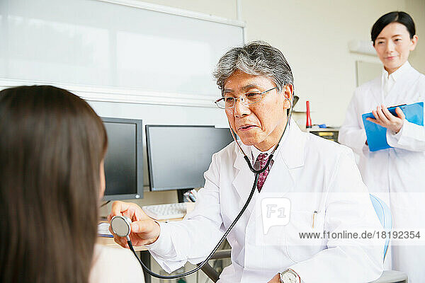 Japanese doctor examining