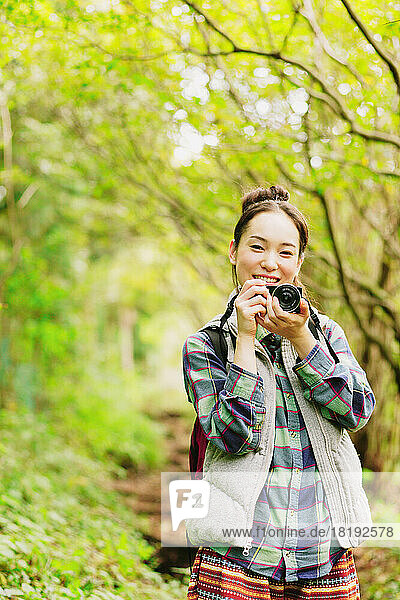 Japanese woman holding a camera