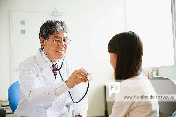 Japanese doctor examining