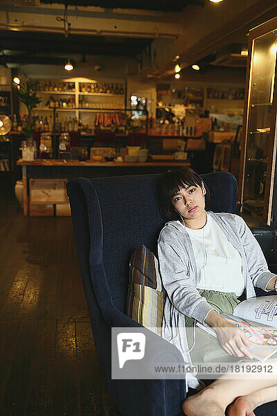 Young Japanese woman relaxing at a cafe