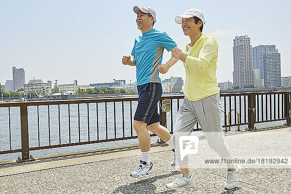 Japanese senior couple jogging